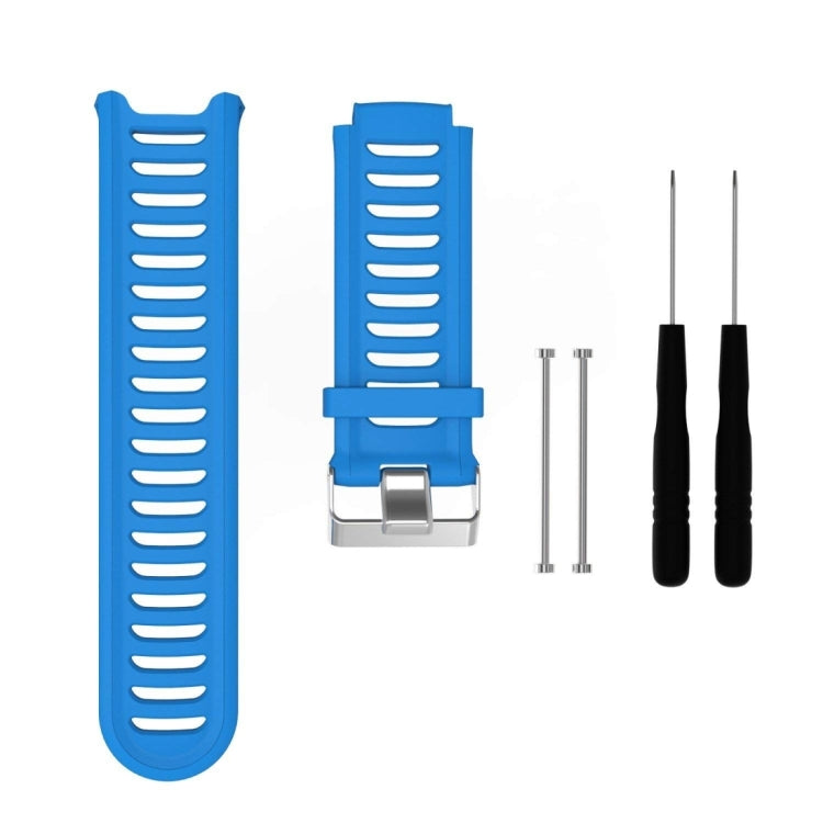 Blue silicone watch band with ridged strap and metal clasp, with extra pin tools