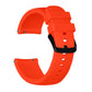 Orange silicone watch band with textured strap ends, metal pins, and adjustable holes