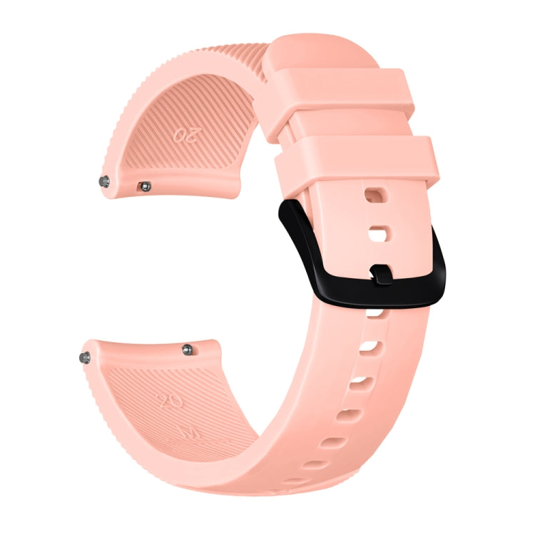Light pink silicone watch band with textured strap ends and side buckle with holes