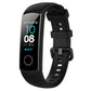 Black silicone watch band with buckle and perforated strap, shown with smartwatch display