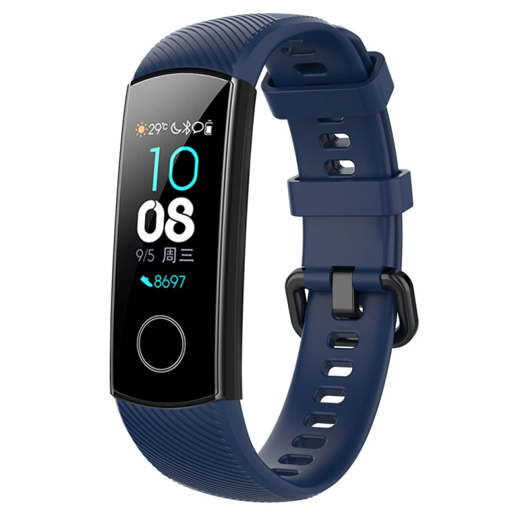 Blue silicone smartwatch wrist band with adjustable buckle and perforated strap holes