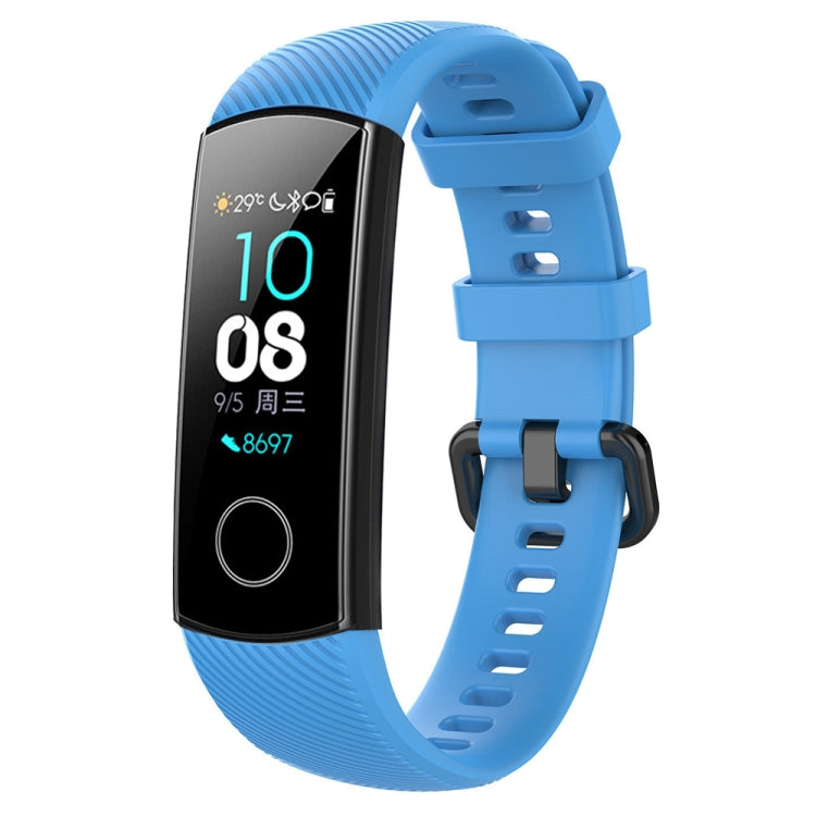Blue silicone smartwatch wrist band with adjustable buckle and perforated strap holes