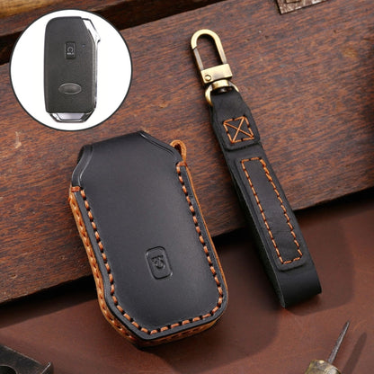 Black cowhide leather key protective cover with stitched edges and logo detail