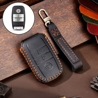 Black leather key protective cover with stitched edges and key ring strap