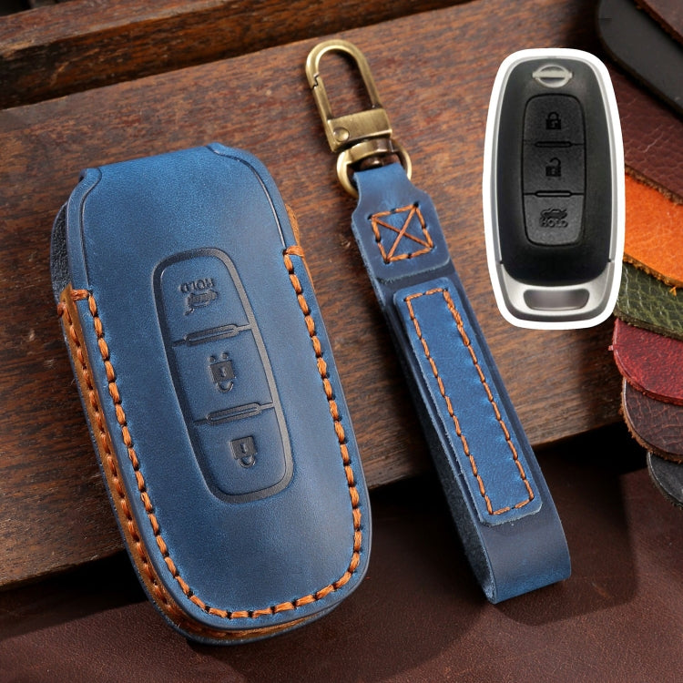 Blue leather key fob cover with orange stitching and key ring loop