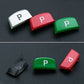 P shift button caps in white, red, and green with mounting clip pieces