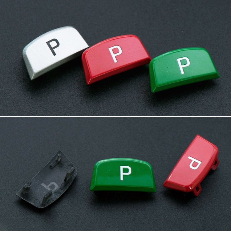P shift button caps in white, red, and green with mounting clip pieces