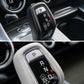 Gear selector with illuminated P shift button on black automatic knob