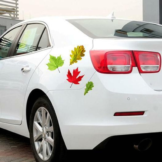 Set of 3D leaf-shaped self-adhesive car scratch stickers on a white car panel