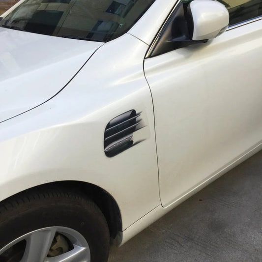 Car door faux vent decorative sticker, dark slatted insert on light vehicle panel
