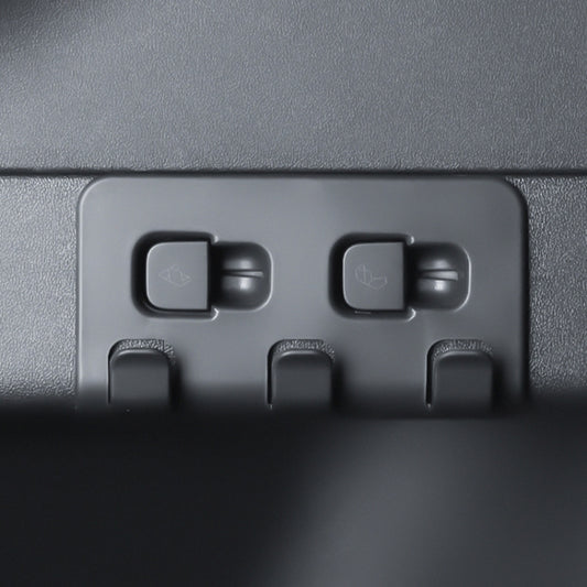 Snap-on trunk button storage hooks installed on dark car trunk button panel