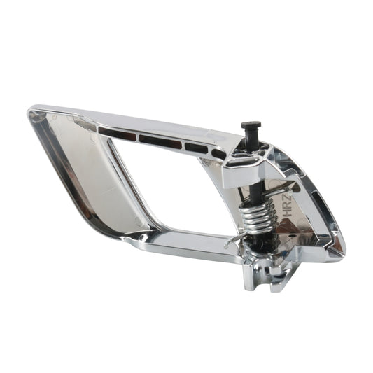Chrome interior door handle bezel with spring and mounting clip assembly