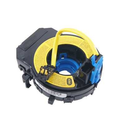 Clock spring spiral cable with black housing, yellow label, blue center and loop harness