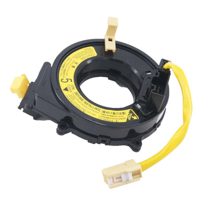 Black spiral cable clock spring with yellow wiring and beige connectors