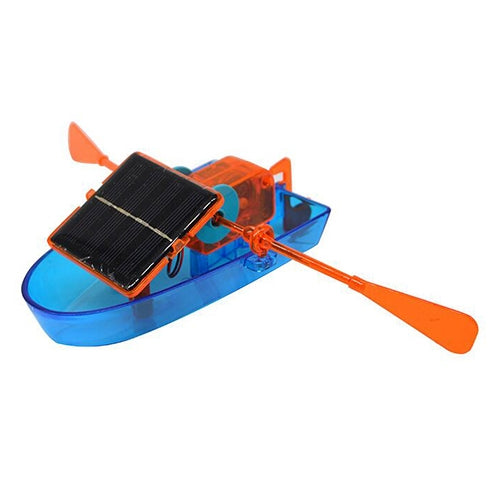 Blue solar-powered toy boat with black solar panel, orange propeller and oars