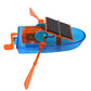 Close-up of solar-powered toy boat with black solar panel and orange propeller