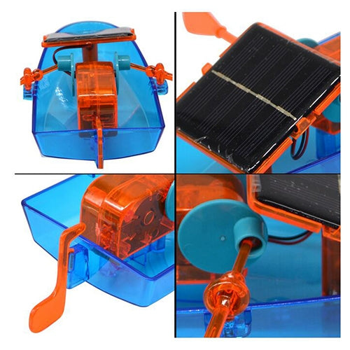 Solar-powered toy boat close-up of blue hull, orange gearbox and black solar panel