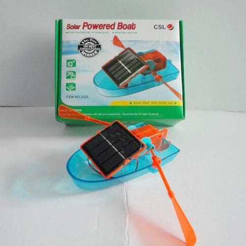 Solar-powered toy boat with blue hull and black solar panel shown with product box