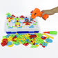 DIY peg mosaic building board with colorful pieces and orange handheld drill