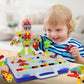 Toddler playing with DIY peg mosaic screw-and-nut building set on tabletop