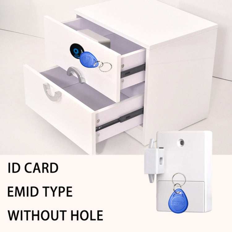 Cabinet door magnetic card lock with blue ID key tag on white cabinet