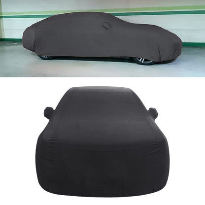 Black sedan car cover with draped hood shape and side straps
