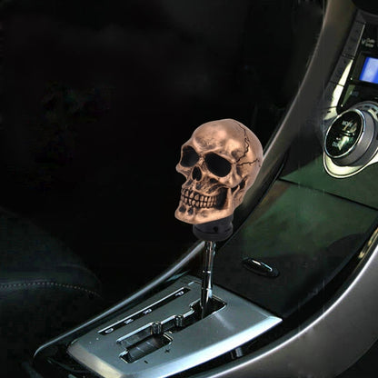 Bronze skull gear shift knob with black textured base and mounting stem