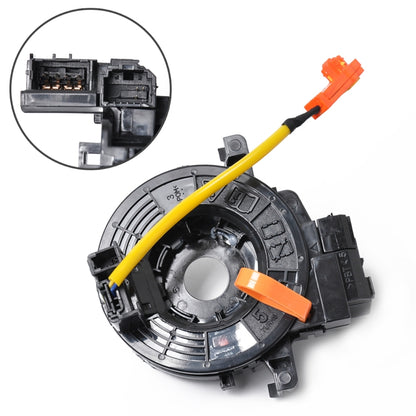 Clock spring contact assembly with yellow spiral cable and orange connectors