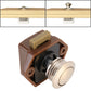 Brown press-to-release cabinet latch with black insert and round light knob