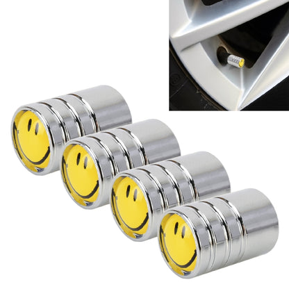 Set of 4 chrome valve stem caps with yellow smile face inserts