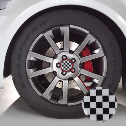 Round wheel hub center cover with black-and-white checker grid pattern