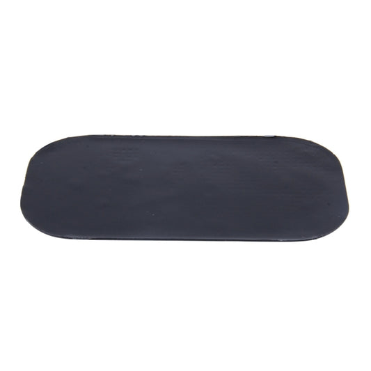 Car anti-slip mat, dark solid backing pad with rounded oval shape for mounting.