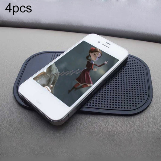 Car anti-slip phone mat, dark perforated pad holding a smartphone on the dashboard.