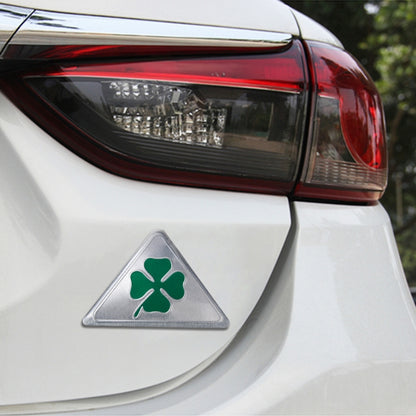 Triangular aluminum car badge with green four-leaf clover emblem