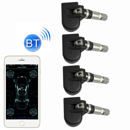 Set of four black TPMS tire sensors with silver metal valve stems