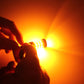 3157 LED bulb glowing bright amber for brake or turn light use