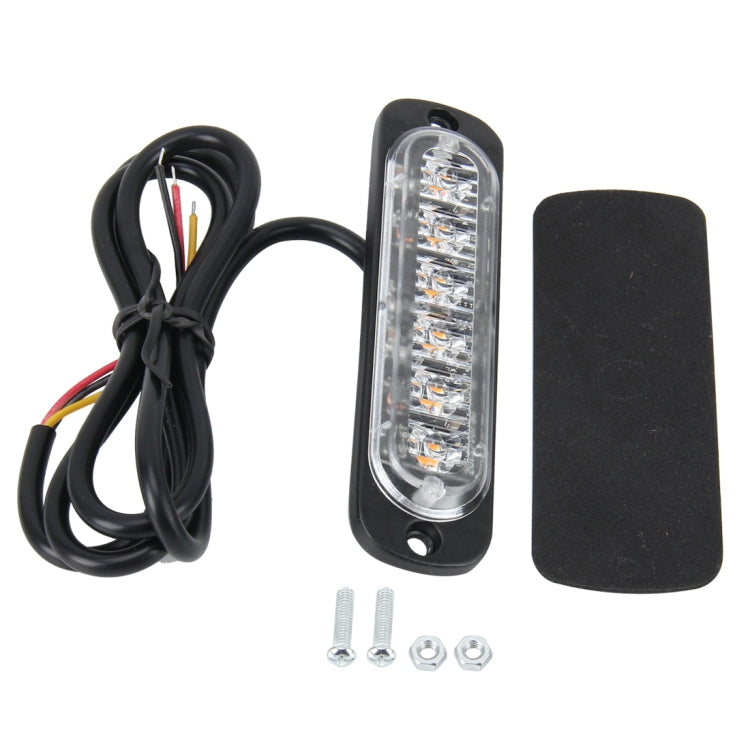Amber LED strobe light kit with wiring harness, mounting screws, and adhesive pad