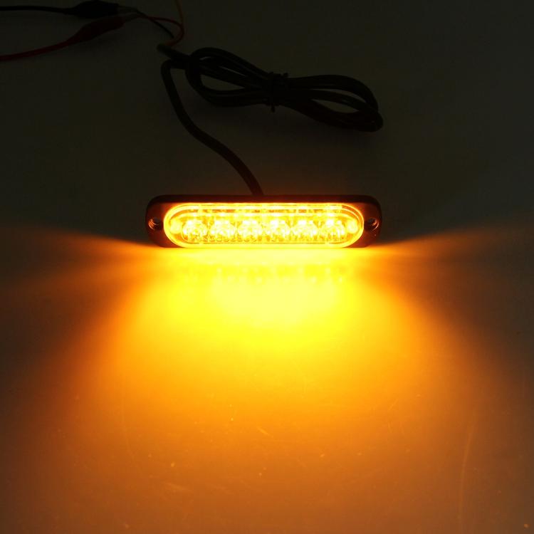 Amber LED strobe light illuminated, producing a warning flash from the front lens