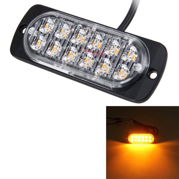 12-LED strobe warning light emitting bright amber glow, black housing and clear lens.