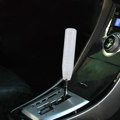 Transparent LED shift knob light installed on car gear lever, white glowing bubbles