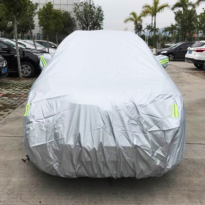 Light gray SUV car cover with green warning stripe accents, full cover over vehicle