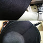 Close-up of dark black non-woven grow bag fabric, reinforced seams and inner lining