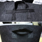 Reinforced carry handle straps on dark black fabric grow bag, open top