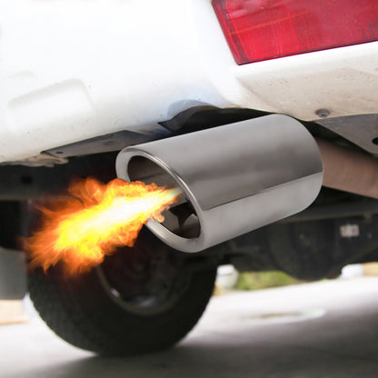 Stainless steel exhaust tailpipe tip with dark outlet opening, shown with flame.