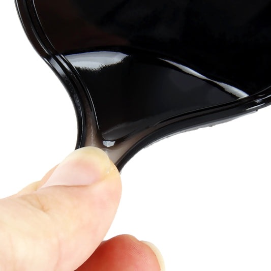 Round flexible black anti-slip rubber mat, close-up of curved edge