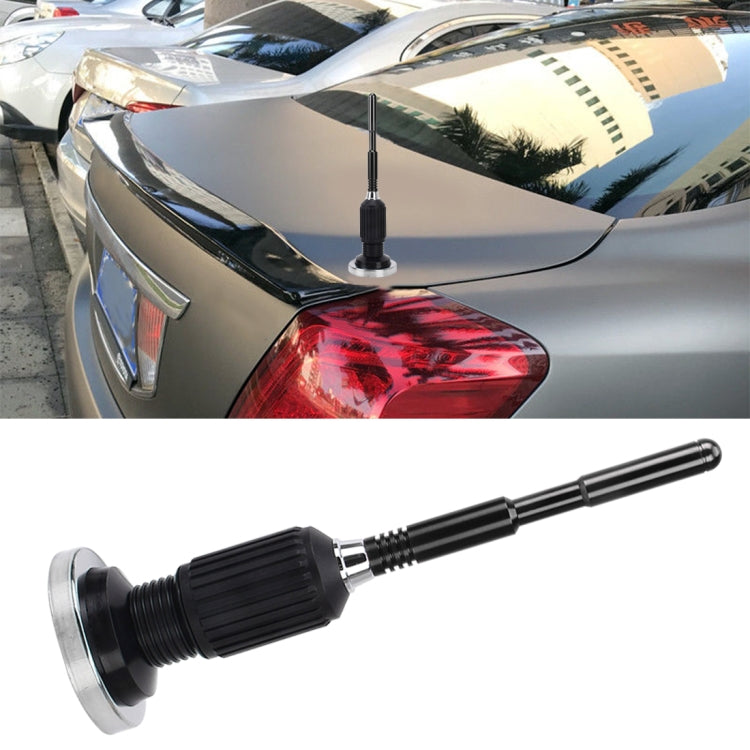 Car magnetic roof antenna mount with black telescoping aerial rod and round metal base