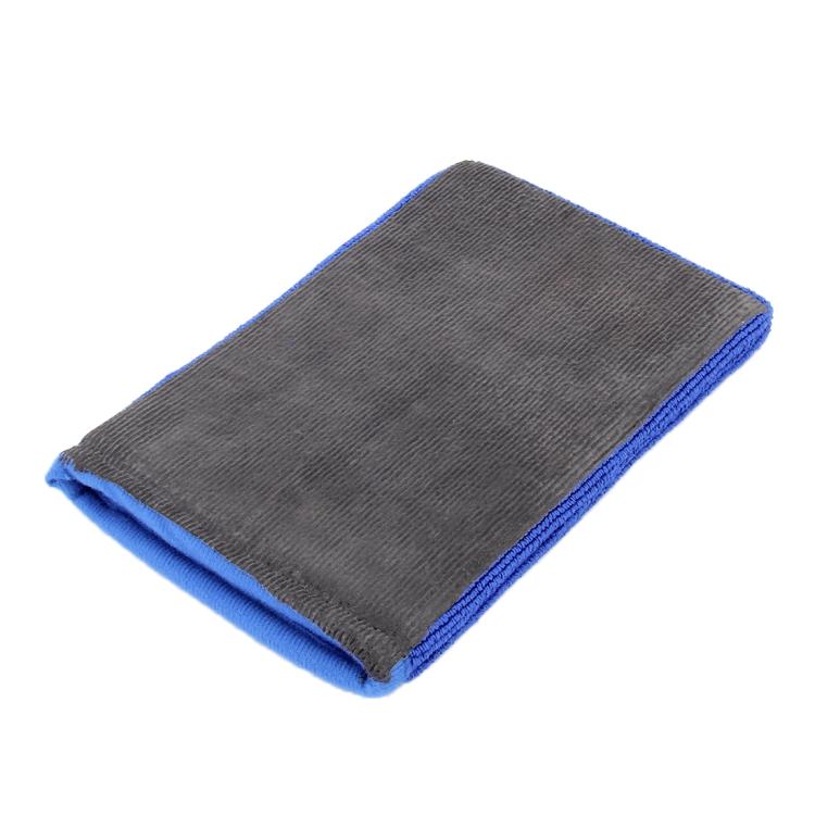 Folded car washer glove, dark gray surface with blue trim edge