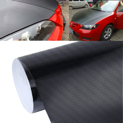 Gloss black carbon fiber vinyl wrap applied to car hood and upper body panels