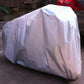 Lavender bicycle cover draped over motorcycle-style wheels