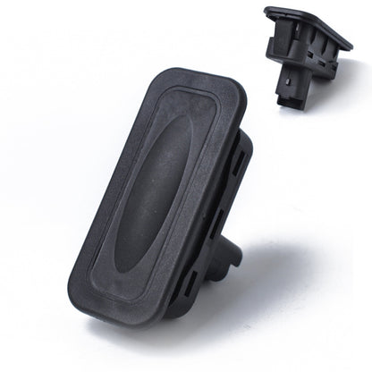 Dark gray tailgate boot release button switch with mounting tabs